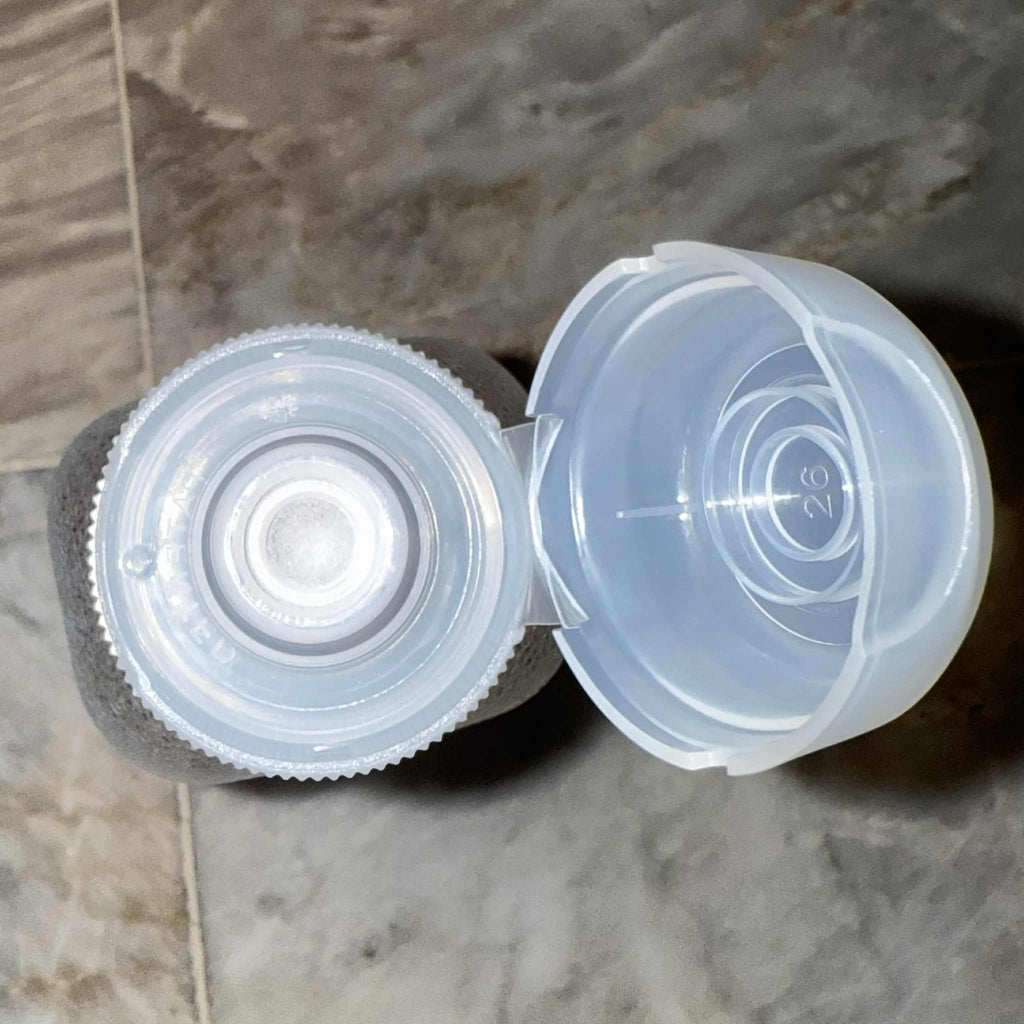 Non-spill plastic bottle